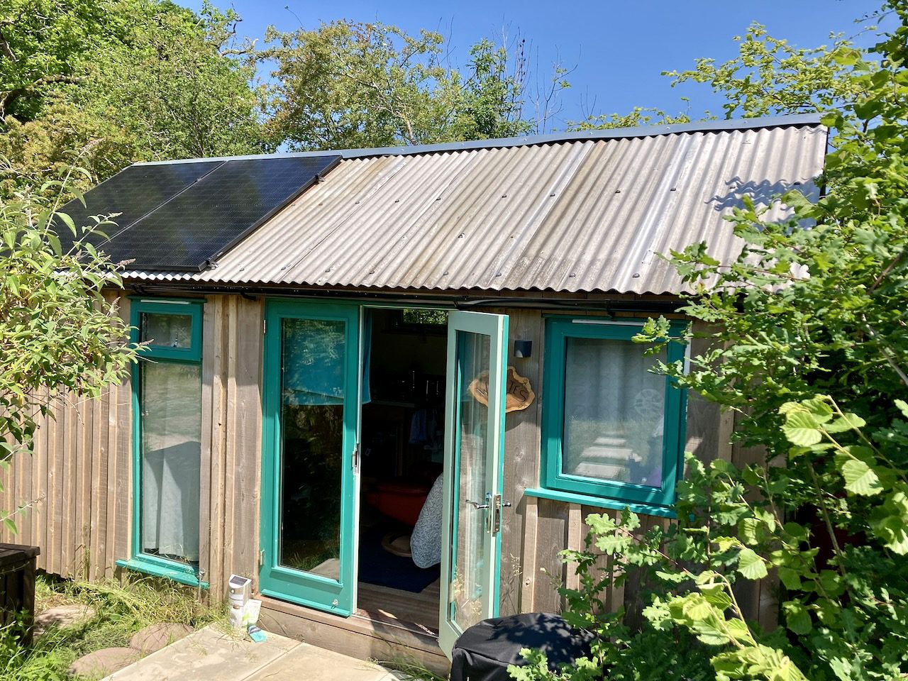 Small off-grid cabin powered by solar and battery